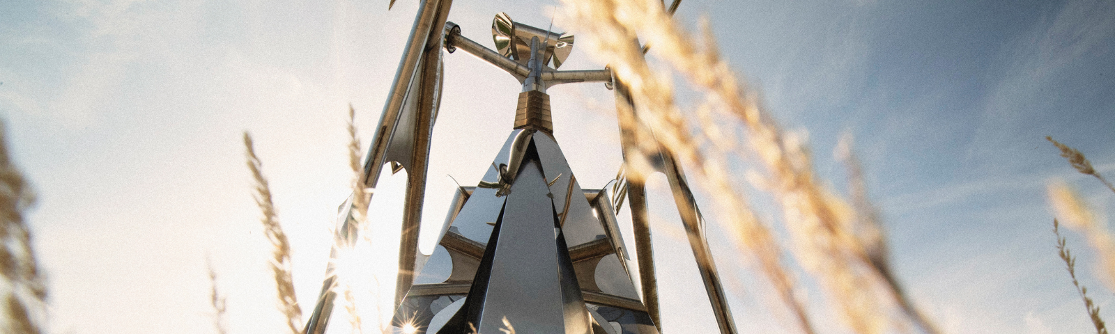A large metal sculpture of a praying mantis