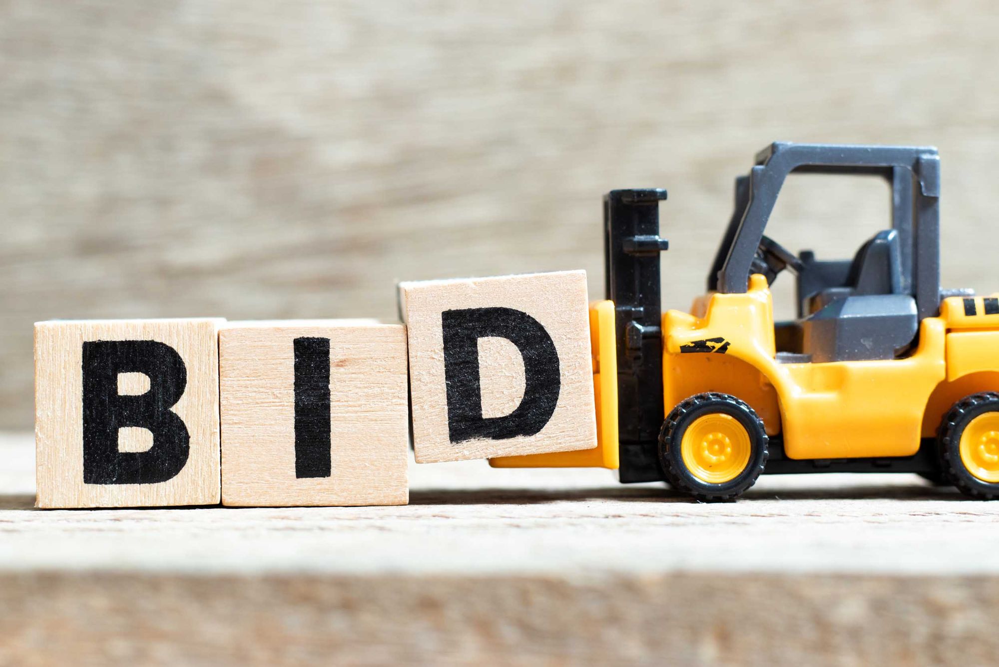 toy forklift holding word Bid