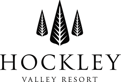 Company logo with black trees