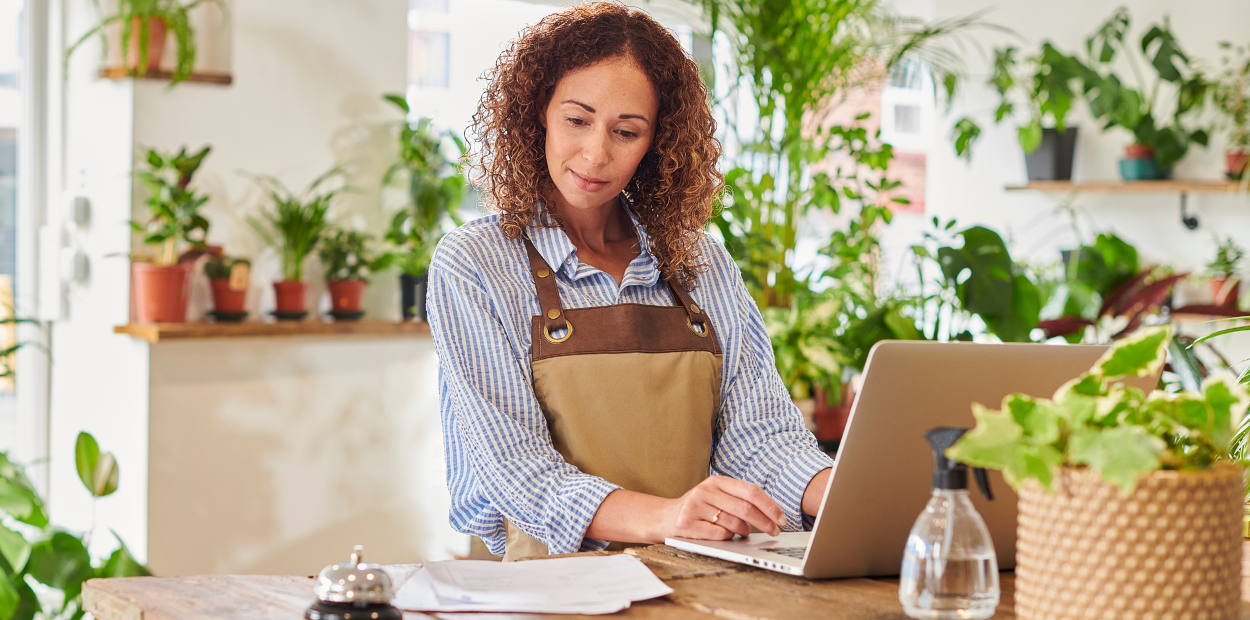 A woman looking at a computer