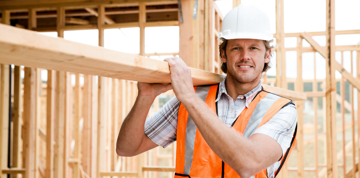 A man carrying lumber