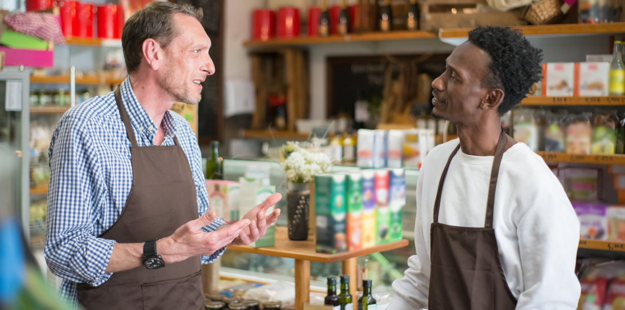 WSIB and workplace health and safety Two men facing each other and talking