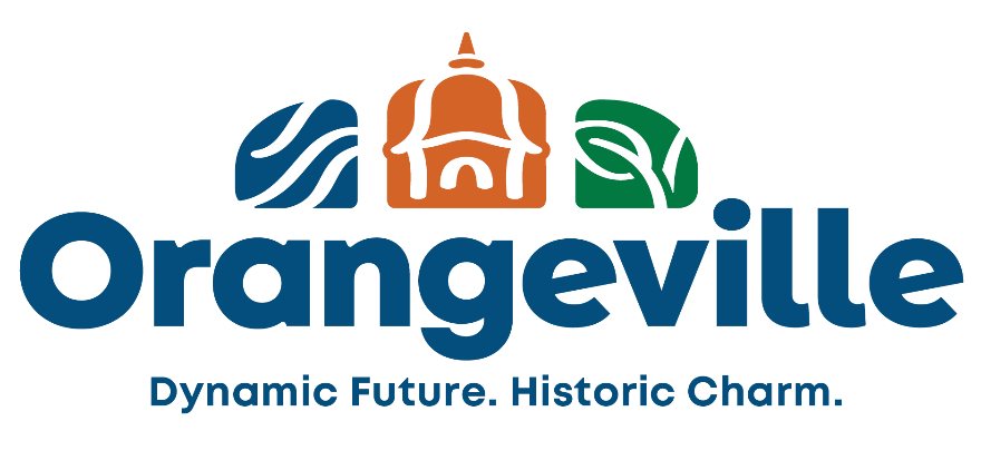 Refreshed Town of Orangeville logo. The logo is made up of bold, navy blue text "Orangeville" with the tagline "Dynamic Future. Historic Charm." centred directly below. Above the "Orangeville" text are three icons forming a single arch. The icons from left to right are: waters (navy blue wave icon) that represents our hills and headwaters; the centre icon is orange (town hall cupola) represents our cultures and historic charm; the right icon is green (leaf) represents our connection to nature.  