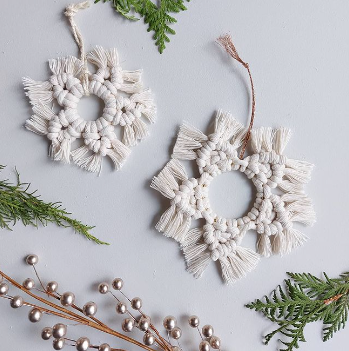 Two white macrame snowflakes