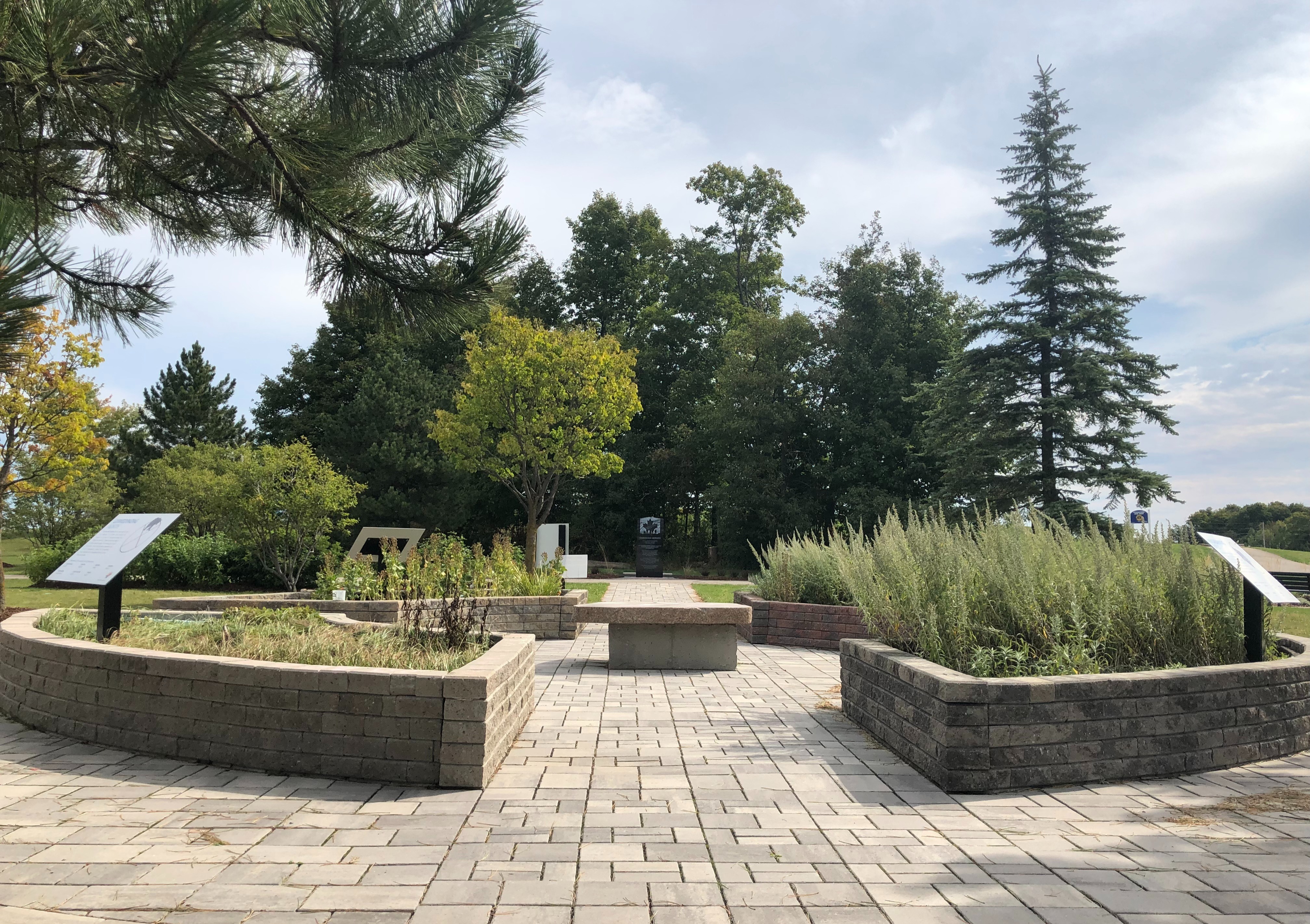 A garden with four raised beds arranged in a circle. 