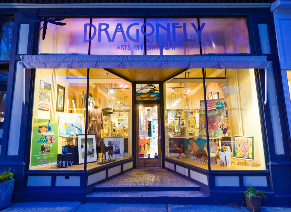 Dragonfly Arts on Broadway Art store entrance at night