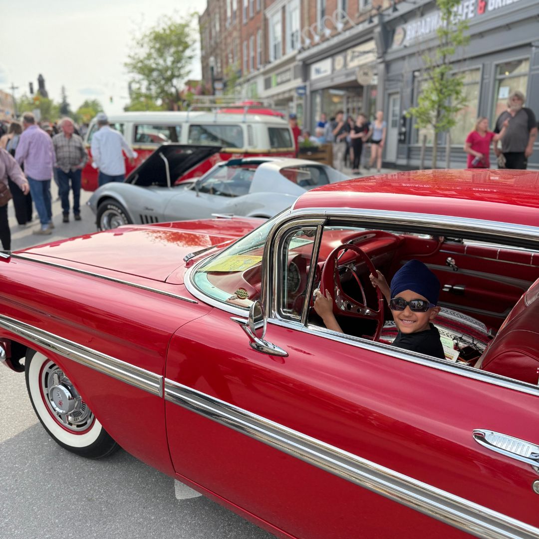 A child sitting in a red car