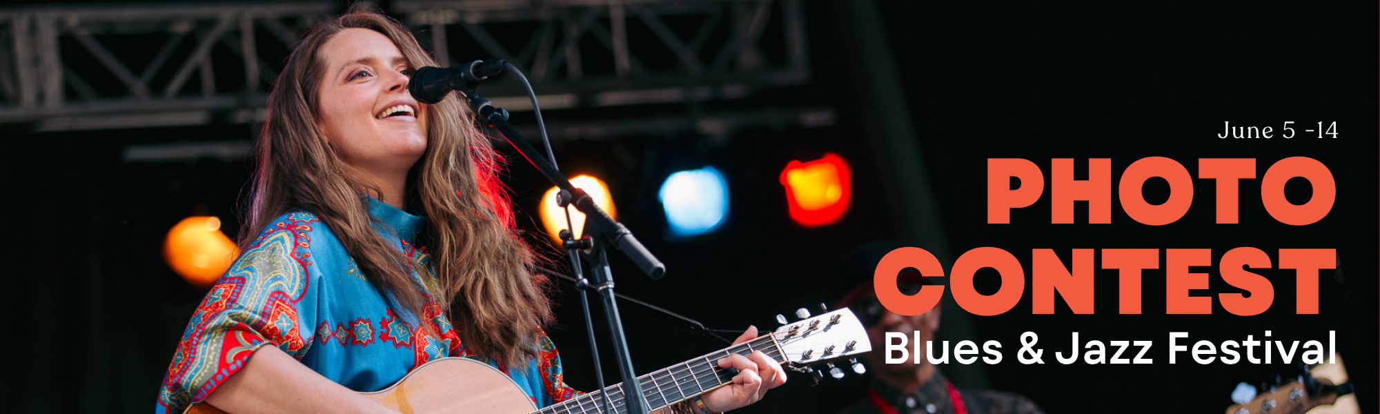 A banner with a musician playing a guitar. The copy reads "Blues and jazz festival photo contest"