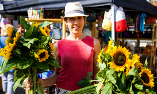 Woman holding sunflowers