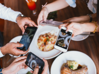 People taking of food with phones