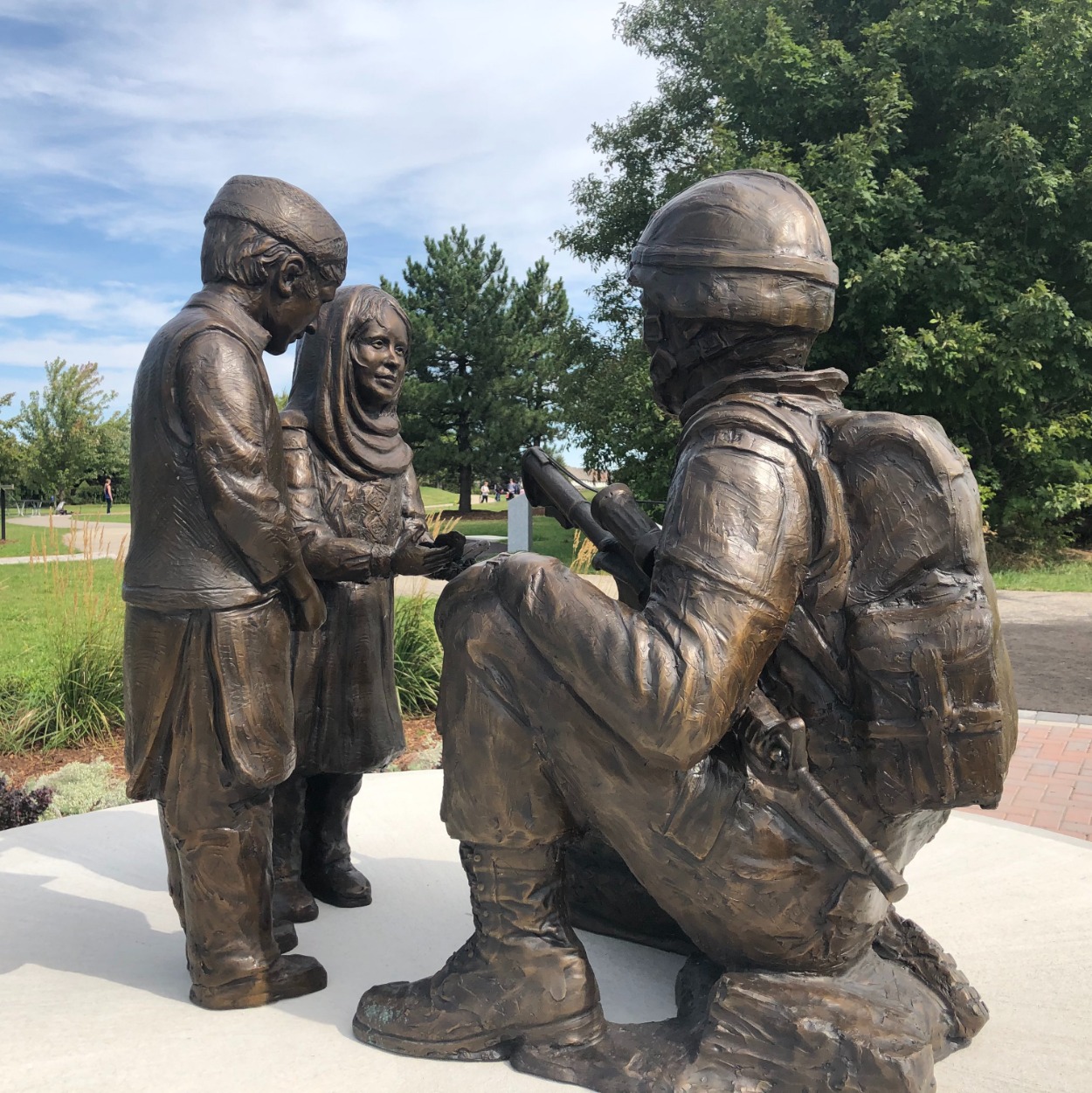 Sculpture of soldier with two children